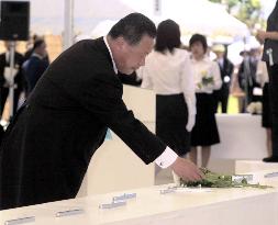 Mori lays flowers in Okinawa ceremony